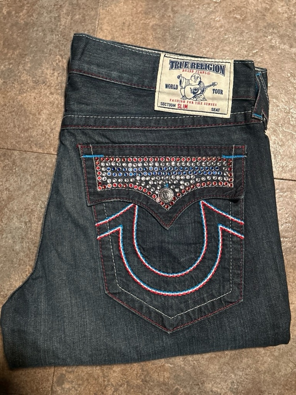 True Religion Men's Indigo Slim Jeans with Red & Blue Stud Accents